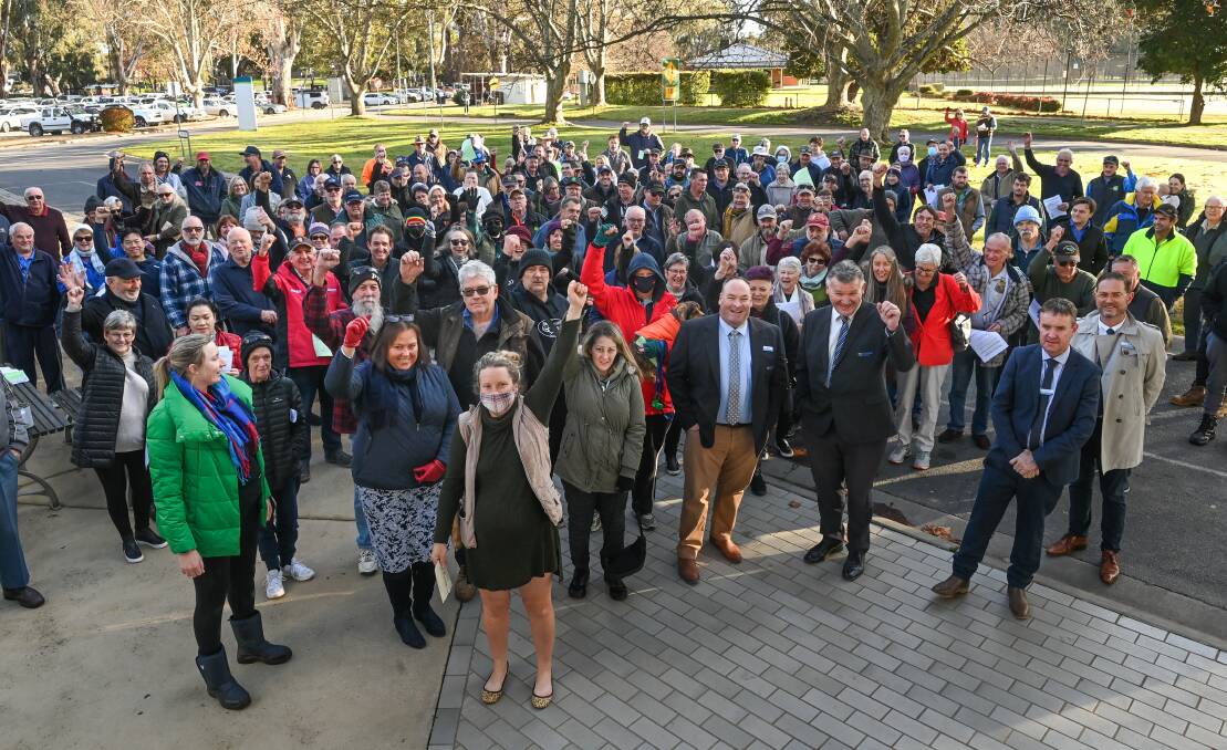 Strength in numbers: Elise Wenden stands at the front of concerned ratepayers and Federation representatives at the Corowa Civic Centre on Tuesday morning. Picture: MARK JESSER