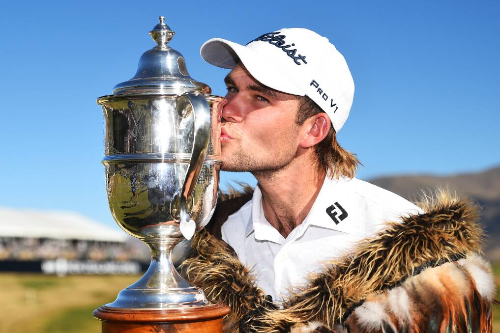 Champion: Zach Murray kisses the trophy after donning a Maori cape following his victory in the New Zealand Open on Sunday afternoon. Picture: PHOTOSPORT NZ