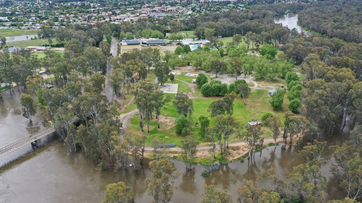 An aerial view of Corowa's Ball Park Caravan Park taken in late 2022 when flooding resulted in evacuations. Federation Council is now looking to have a new model of operation to bolster investment in the site. Picture by Mark Jesser 