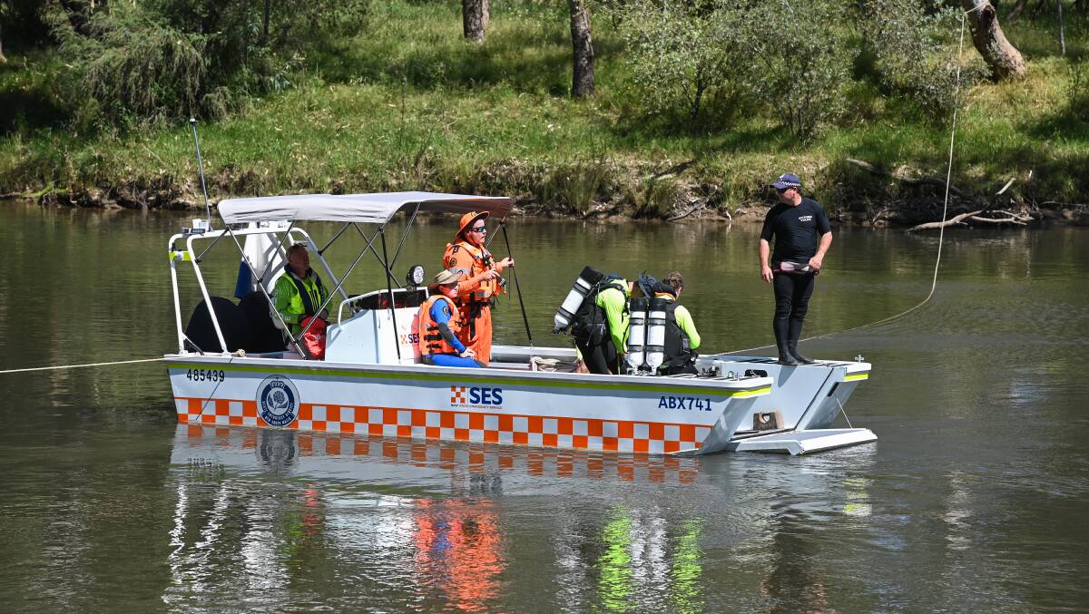 Search key: Divers use an SES vessel as a launch point to search for missing swimmer Jules Lunanga on Sunday morning. Picture: MARK JESSER