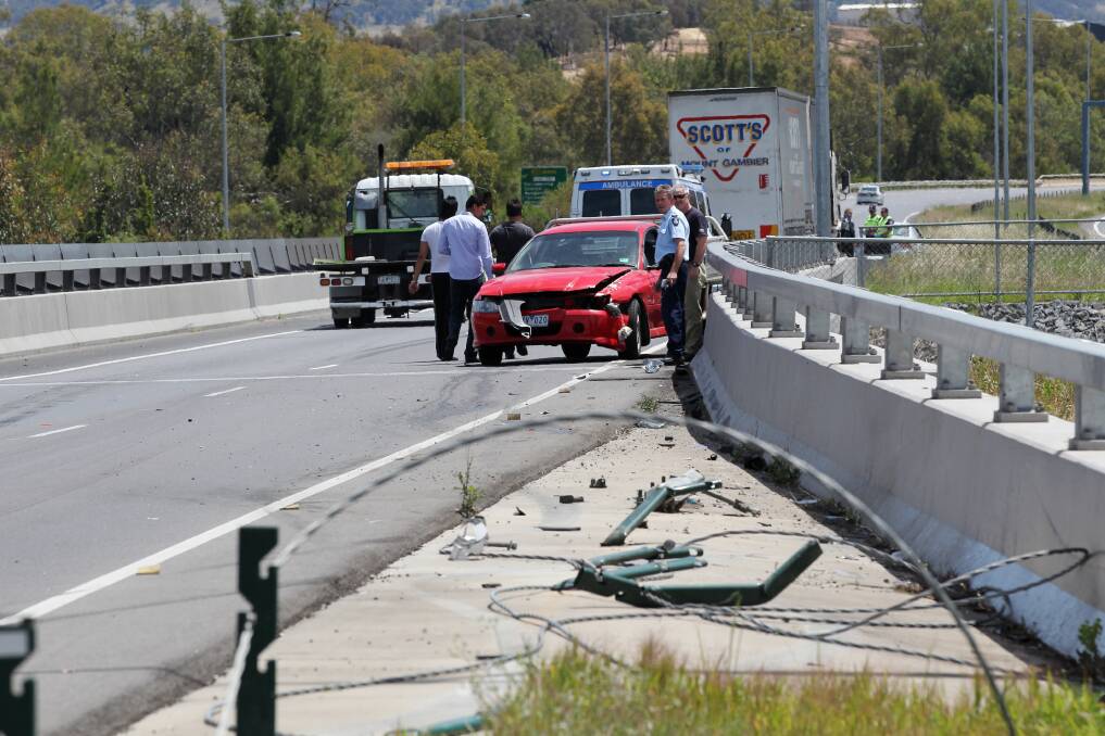 Full impact: Flattened posts and loose wire after a 2011 crash involving a ute and a truck on the Hume Freeway bridge crossing Wodonga's High Street.