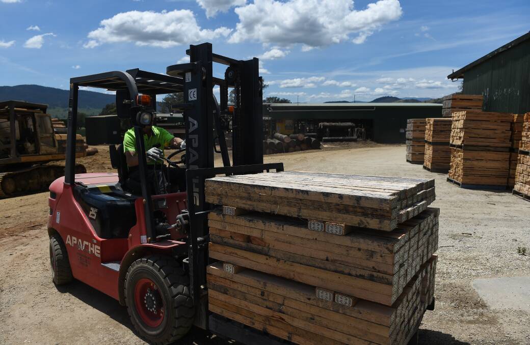 Processed timber is moved around at Walkers Sawmill which is now expected to close by the end of the year. Picture by Mark Jesser