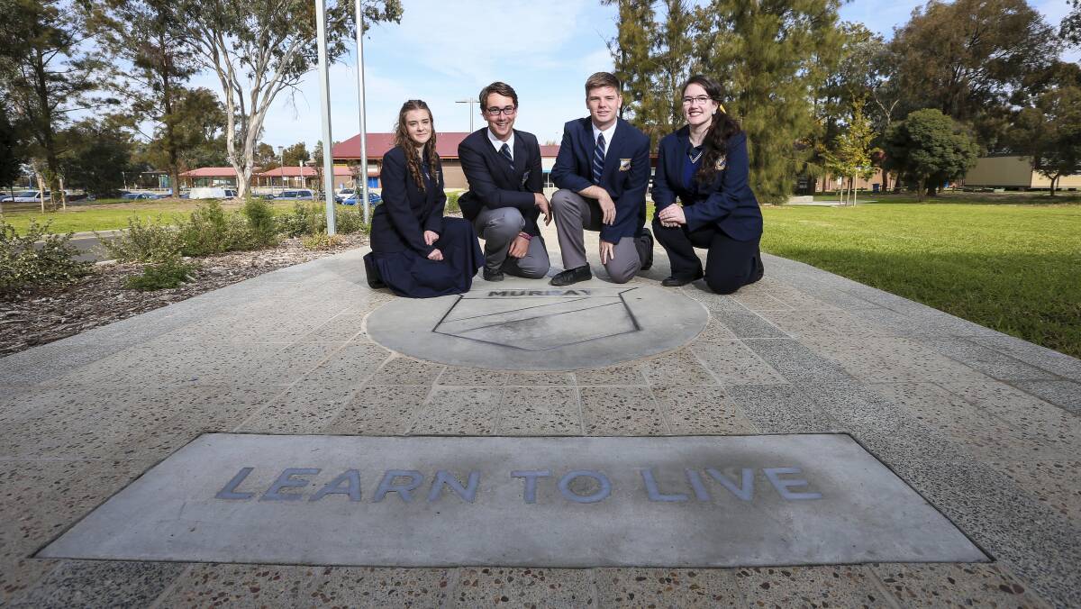 Fresh welcome: Murray High student leaders Ashleigh Grentell, William Judd, Jarrod Scammell and Esther Robinson at their school's new entry path with its motto embedded. Picture: JAMES WILTSHIRE