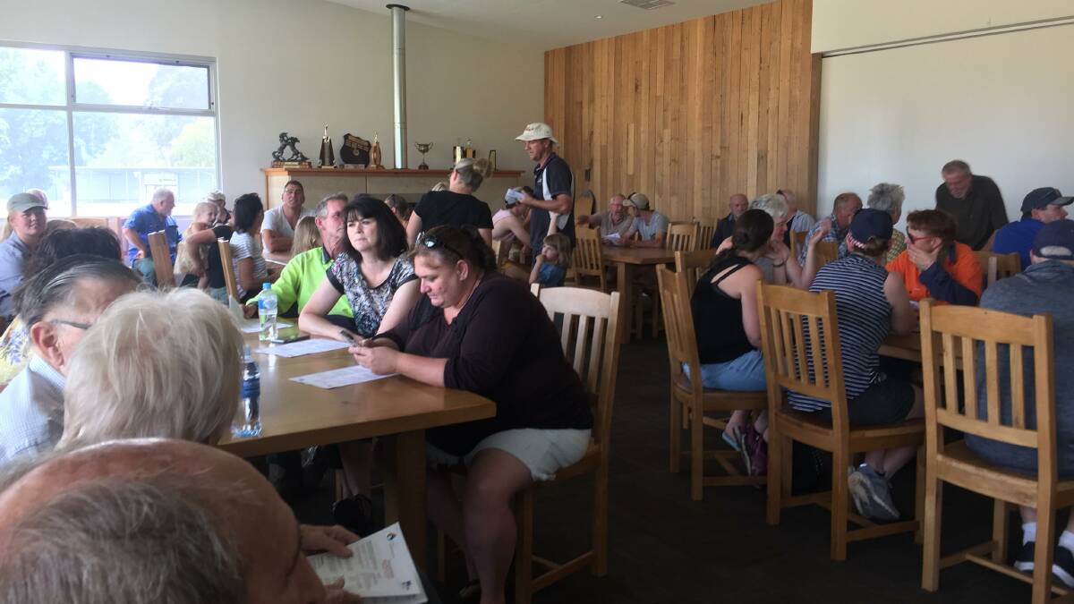 All ears: Part of the audience that gathered on Wednesday afternoon at Mitta's oval pavilion to hear about bushfire planning.