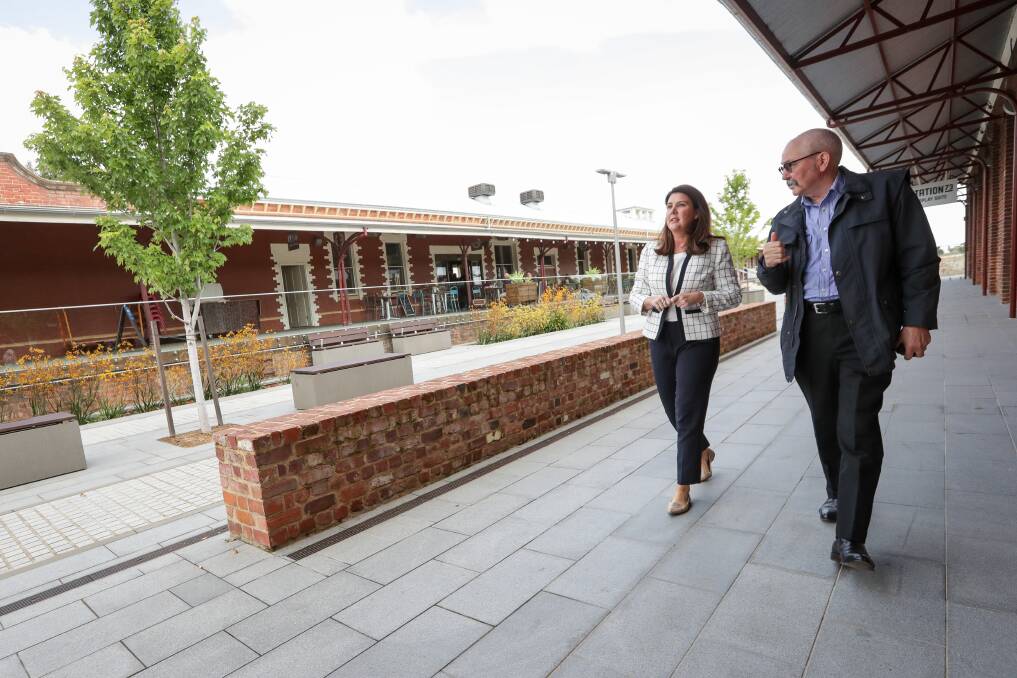 Inspection: Senator Jane Hume joins Wodonga councillor Ron Mildren in looking over the progress of Junction Place, the city's former railway station precinct. Picture: JAMES WILTSHIRE