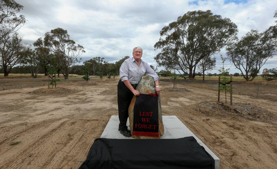 Rehonouring them: Rutherglen RSL sub-branch president David Martin with covers over the tributes to be launched on Monday. Either side of him are young oaks forming the Avenue of Honour. Picture: TARA TREWHELLA 
