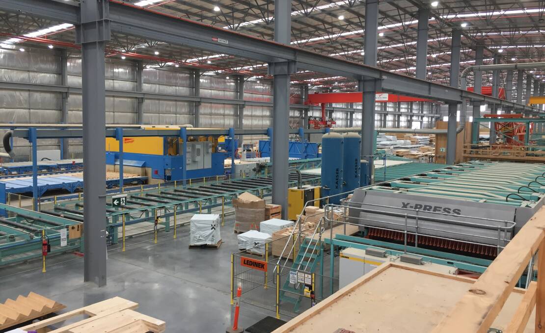 Production line: Machinery used to laminate timber and then cut into shapes at XLam's plant at the Logic estate at Barnawartha North.