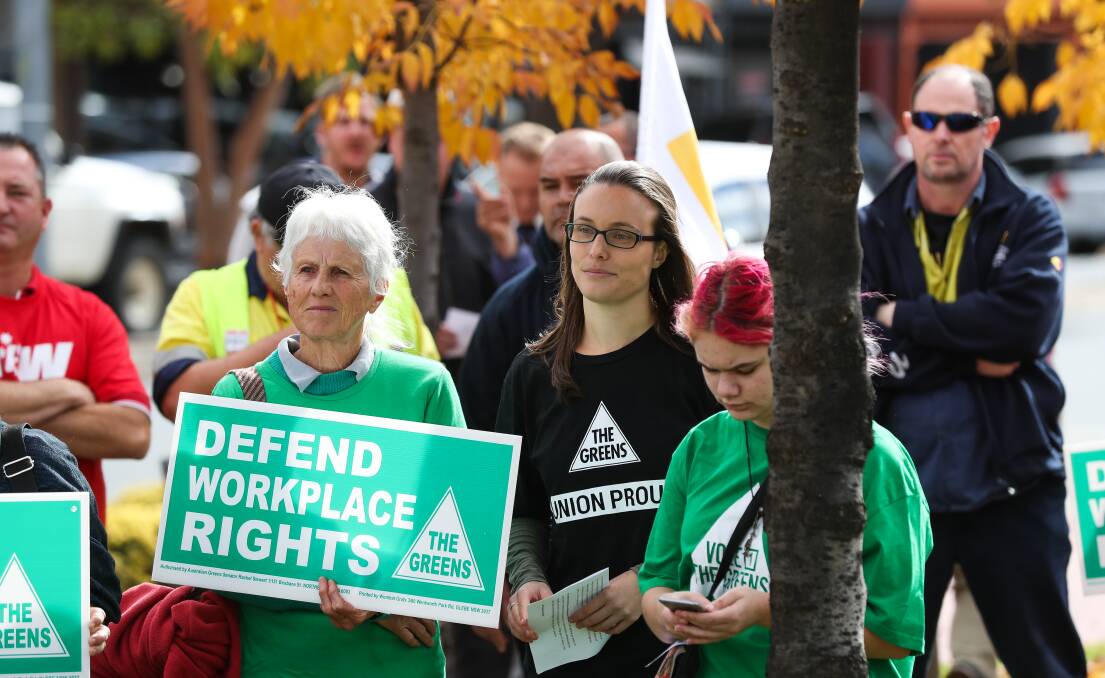 Listening: Albury deputy mayor Amanda Cohn with fellow Greens members takes in the message of speakers at the gathering in Woodland Grove. Picture: MARK JESSER