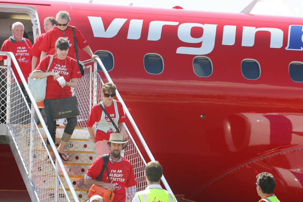 Flashback: Passengers in special T-shirts disembark the first regular Virgin flight from Sydney to Albury in February 2008.