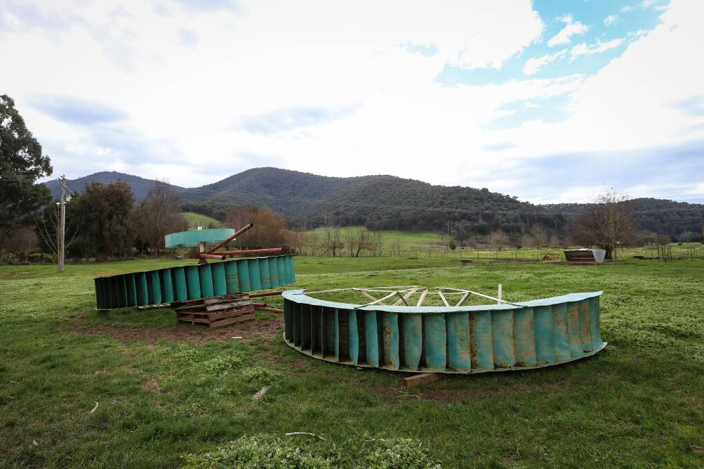 Spun out: The 19th century water wheel used on gold fields now sits in a Tallandoon paddock after being displayed in Albury from 1969 to 2014.  Picture: JAMES WILTSHIRE