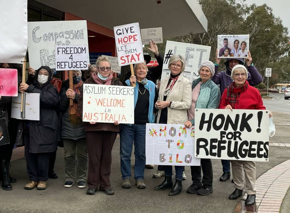 Like-minded: Member for Indi Helen Haines (third from right) with supporters of the Murugappan family at a vigil outside her Wangaratta office on Friday.