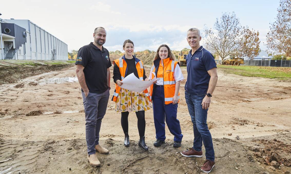 Project engineer Aaron Pitson, product developer Peta Nelson, engineer trainee Demi Shale and Wodonga plant director Brett Brown with plans for the new factory. Picture supplied