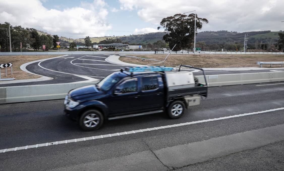Wait goes on: A twincab passes the rejigged intersection of the Hume Highway and McKoy Street in west Wodonga.