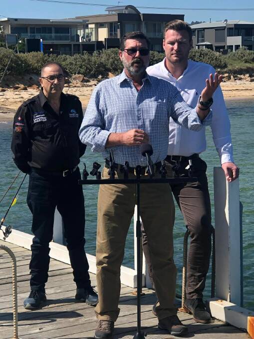 Newly-elected Liberal MP Sam Groth watches on as Bill Tilley makes a fishing announcement in his role as an Opposition spokesman. Picture supplied.