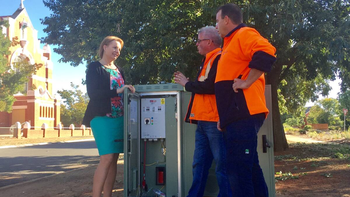 Broadening: Member for Farrer Sussan Ley and Trevor Taggert and Stephen Trimble, from Decon Technologies, at an NBN node in Parade Place, Corowa on Tuesday.