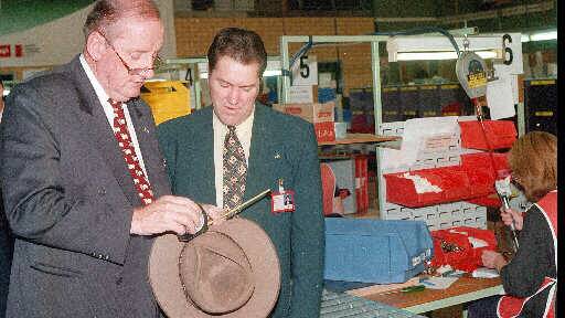 Flashback: Then National Party leader Tim Fischer examines a tape measure made by Cooper Tools in South Albury that was to be exported. The company's managing director Peter Reynoldson watches on.