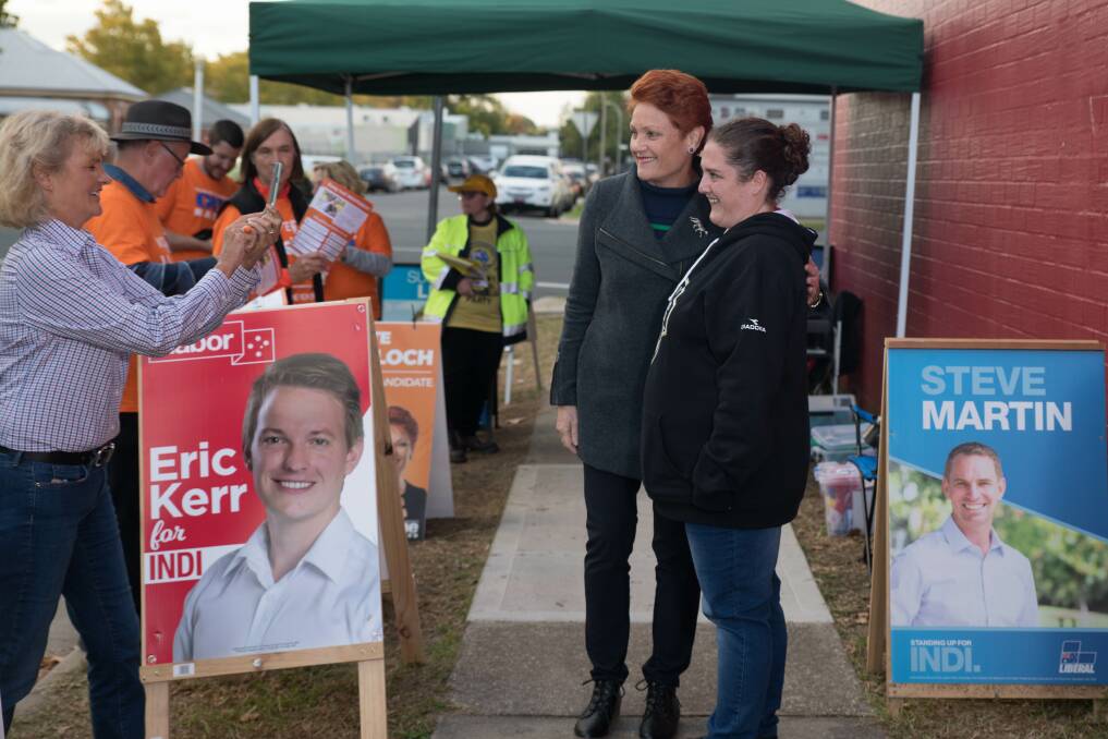 Friendlier company: Pauline Hanson poses for a photo with a supporter as One Nation senate candidate Kate McCulloch takes the shot. Picture: TARA TREWHELLA