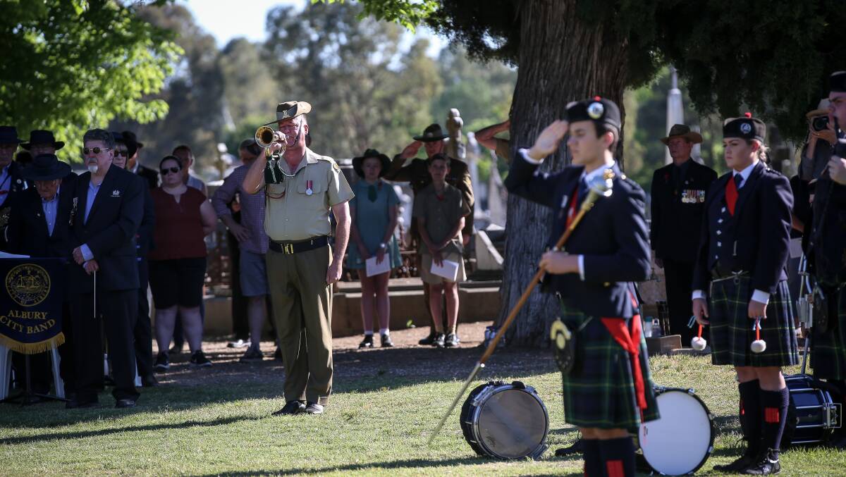 Symbolic moment: The Last Post is played as part of the formalities of the Armistice centenary service at Albury's Waugh Road cemetery. Picture: JAMES WILTSHIRE