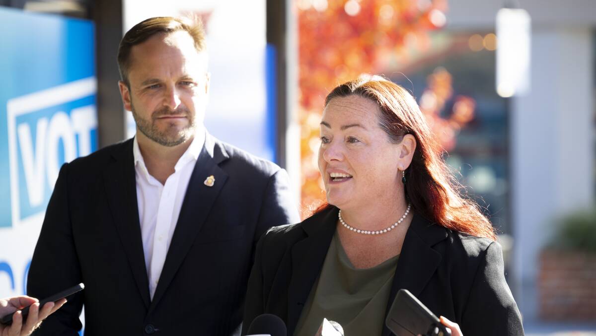 Team-mates: Coalition colleagues Ross Lyman (Liberal) and Liz Fisher (Nationals) speak to the media in High Street, Wodonga, on Friday. Picture: ASH SMITH 