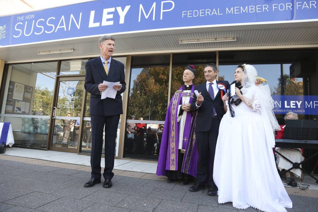 Speak now: Lauriston Muirhead speaks at a mock wedding between Baroness Filthy Fossil and Mr Desperate for Donations Politician outside Sussan Ley's office in 2016.