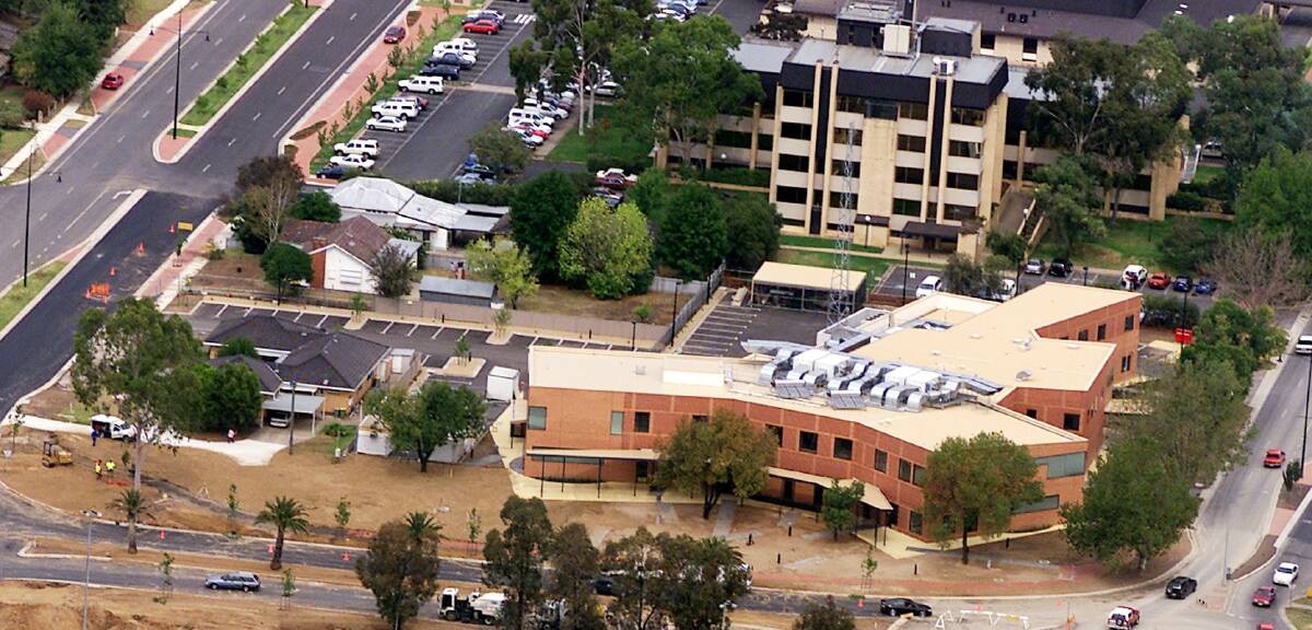 Overview: Aerial photograph showing the Wodonga police station with council offices in the background and council car park at top left where two cars were damaged.