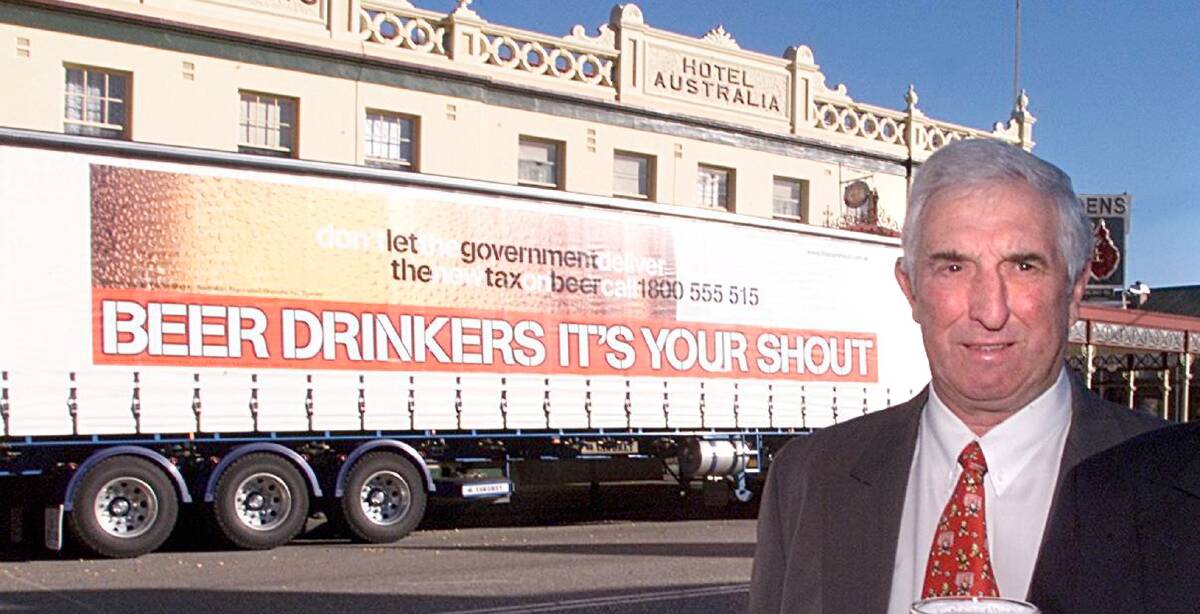 One of many of his pubs: Mal Hutchinson standing in front of Soden's Hotel with a truck that was part of a campaign against tax on beer. 