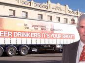 One of many of his pubs: Mal Hutchinson standing in front of Soden's Hotel with a truck that was part of a campaign against tax on beer. 