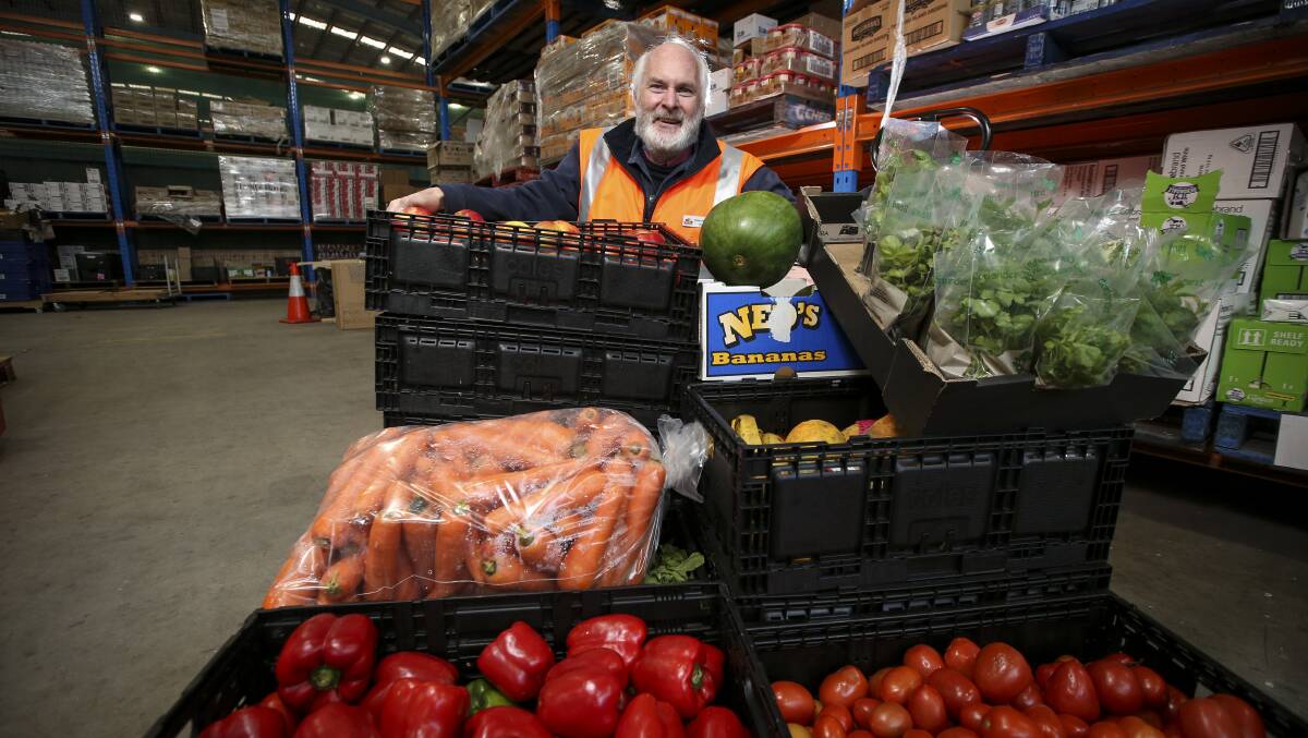 In charge: FoodShare administrator Peter Matthews with some of the fresh produce which passes through the warehouse at TAFE before feeding the needy.