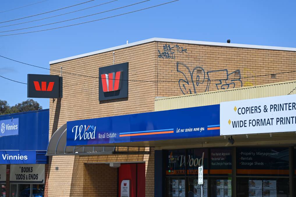 Aerial assault: In recent years vandals have regularly scribbled on the side of the Westpac branch at Lavington. Picture: MARK JESSER