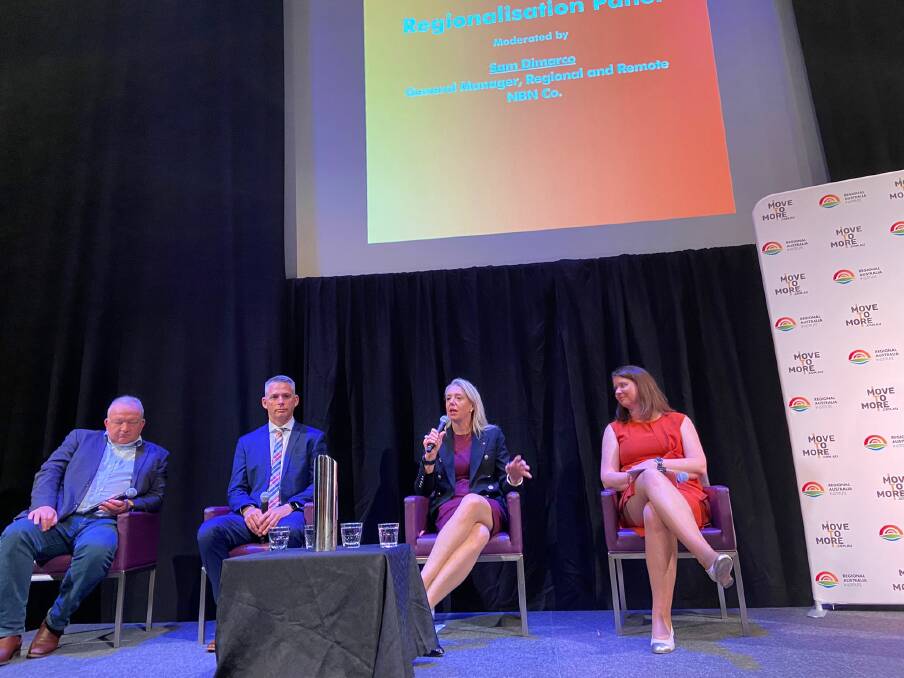 On stage: Bridget McKenzie holds the microphone as part of a panel discussion that also included NBN chief development officer Gavin Williams, Nutrien Ag Solutions managing director Robert Clayton and Liz Ritchie.