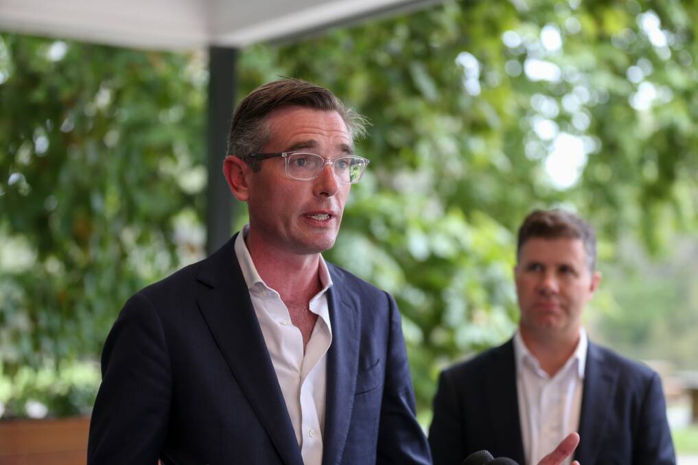 Prepared to find a remedy: NSW Treasurer Dominic Perrottet speaks in Albury as his Liberal parliamentary colleague Justin Clancy watches on. Picture: TARA TREWHELLA