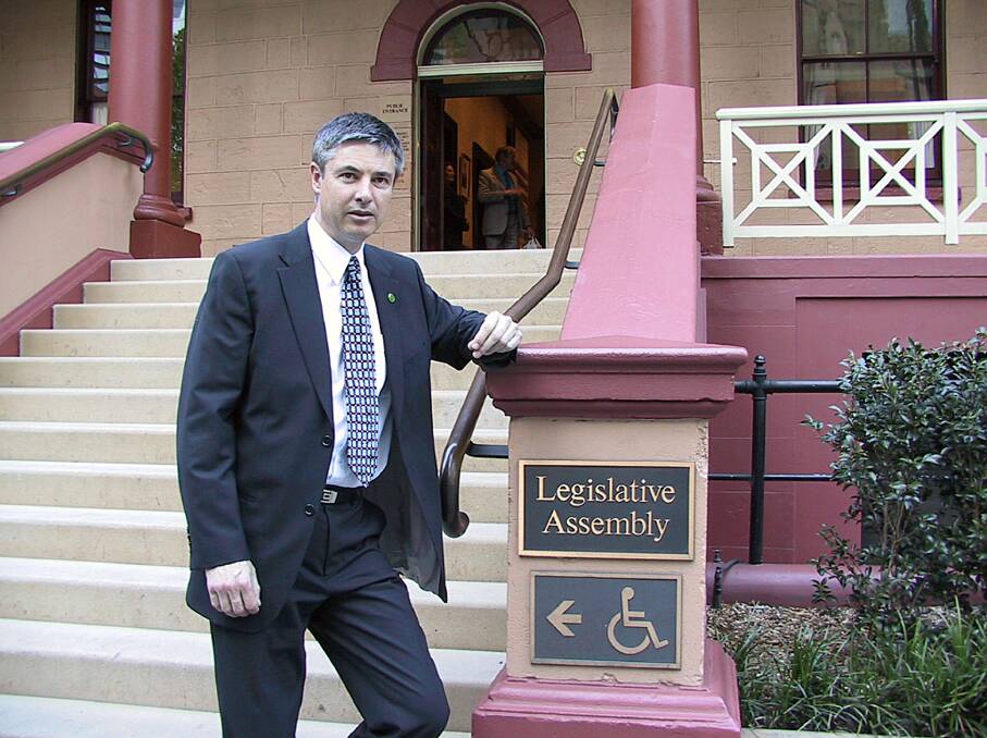On the job: Greg Aplin outside the Lower House at Parliament House in Sydney in his first year as member for Albury.