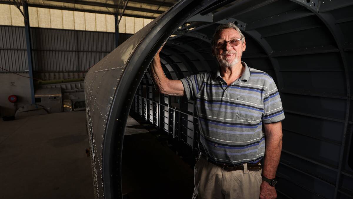 Russ Jacob stands in the frame formed for the cargo door, which can be seen leaning against the hangar wall in the background. There are plans to have the interior of the plane become a theatrette. Picture by James Wiltshire 