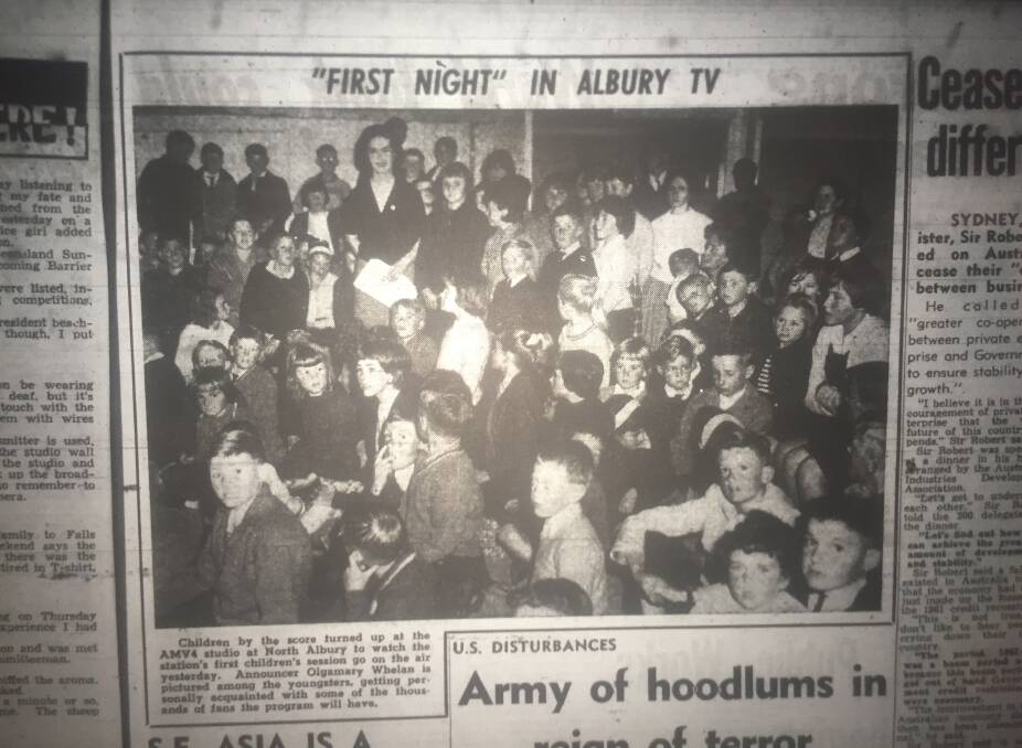 Flashback: Olgamary Whelan stands holding a piece of paper among the scores of school children who attended the opening day broadcast of AMV4. This article appeared on page three of The Border Morning Mail the day after the launch.