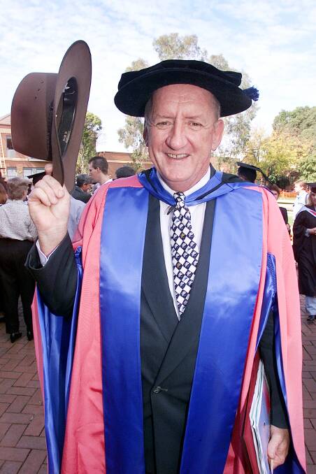 Memorable day: Tim Fischer in May 2001 after receiving his honorary doctorate at a graduation ceremony in Albury.