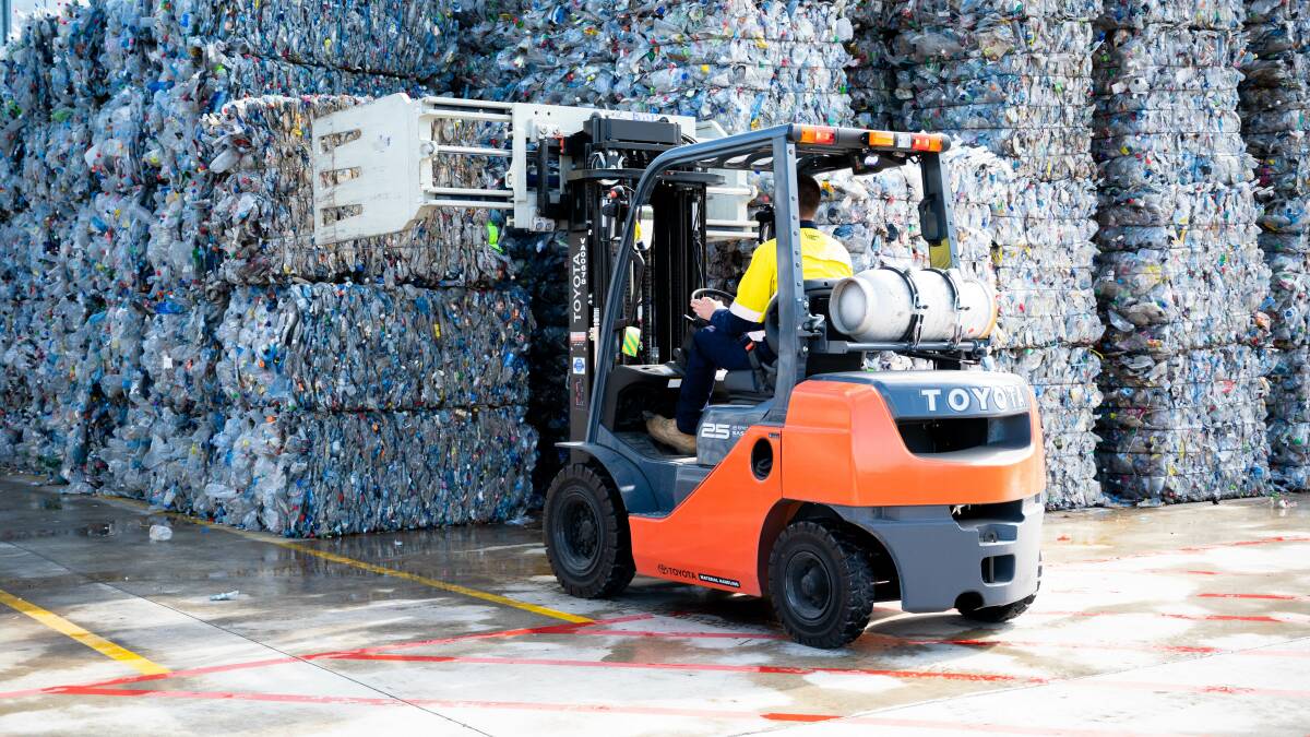 Mountain of plastic: Bundles of bottles are stacked at the new recycling factory at Ettamogah. 