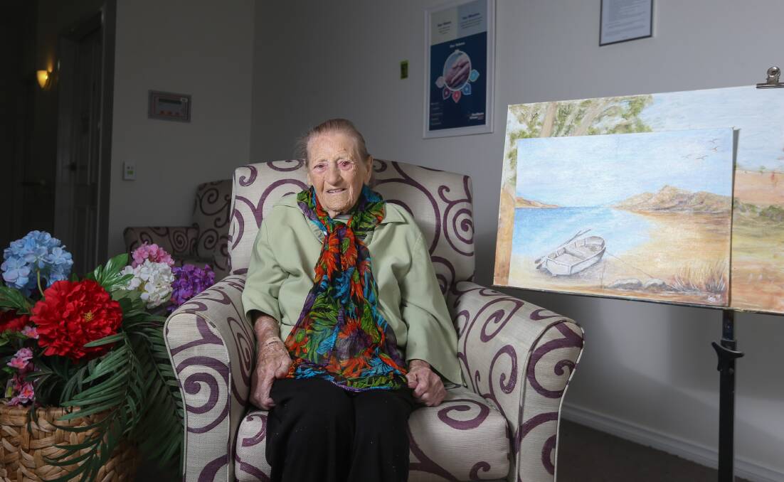 Varied palette: Lola Bradley at her Lavington aged care home with two of her paintings. Picture: TARA TREWHELLA