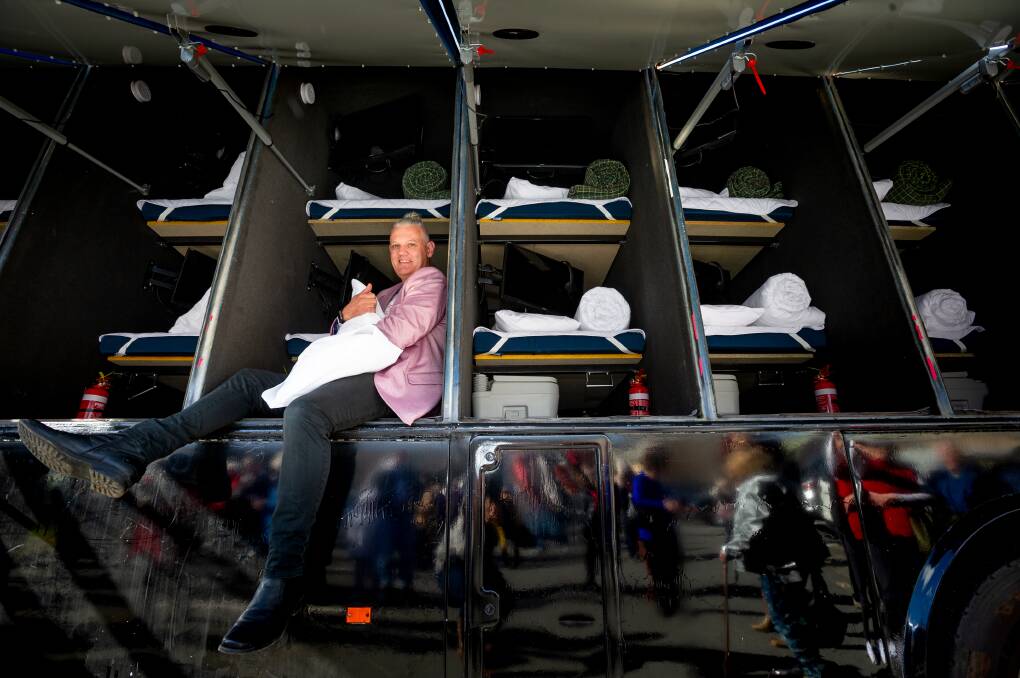 On hand: Simon Rowe with one of his buses for the homeless. Picture: THE CANBERRA TIMES