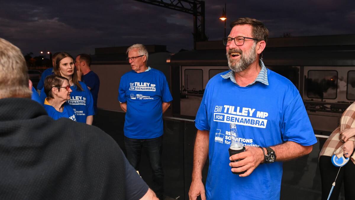Liberal MP Bill Tilley shares a laugh with supporters after appearing to secure a fourth term as member for Benambra. Picture by Mark Jesser. 