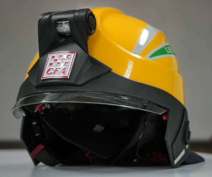 New look: The fresh helmets that are being distributed to volunteer firefighters in the North East. They include a torch above the CFA badge. Picture: CFA