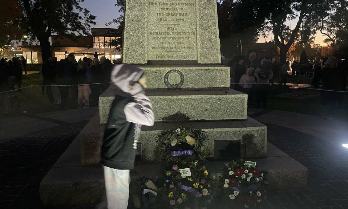 Wodonga resident Freya Ryczak, 9, walks away from the memorial after paying her respects. She was among scores of children to watch the dawn service. 
