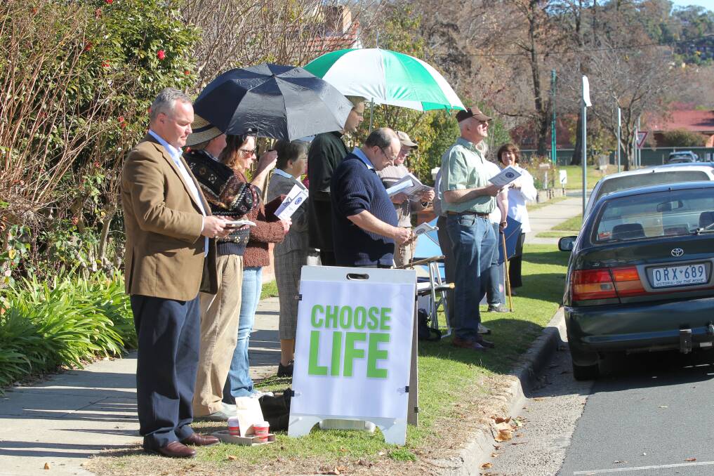 Vindication: Roland von Marburg with demonstrators outside Albury's abortion clinic. He and his wife Anna have welcomed an apology from Pieter Mourik.