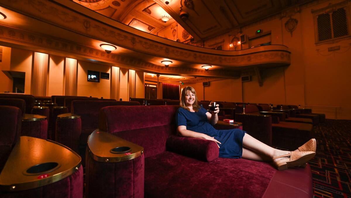 Added comfort: Cinema general manager Kelly Davis enjoys one of the day beds which form the front row of seating in the Regent Lounge. 