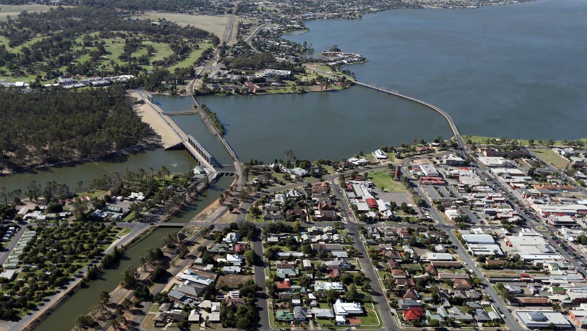 Panorama: An aerial view showing three crossings over Lake Mulwala at Yarrawonga. From left to right they are the weir wall, railway bridge and the span which was completed in 1924 between the Yarrawonga and Mulwala CBDs. 