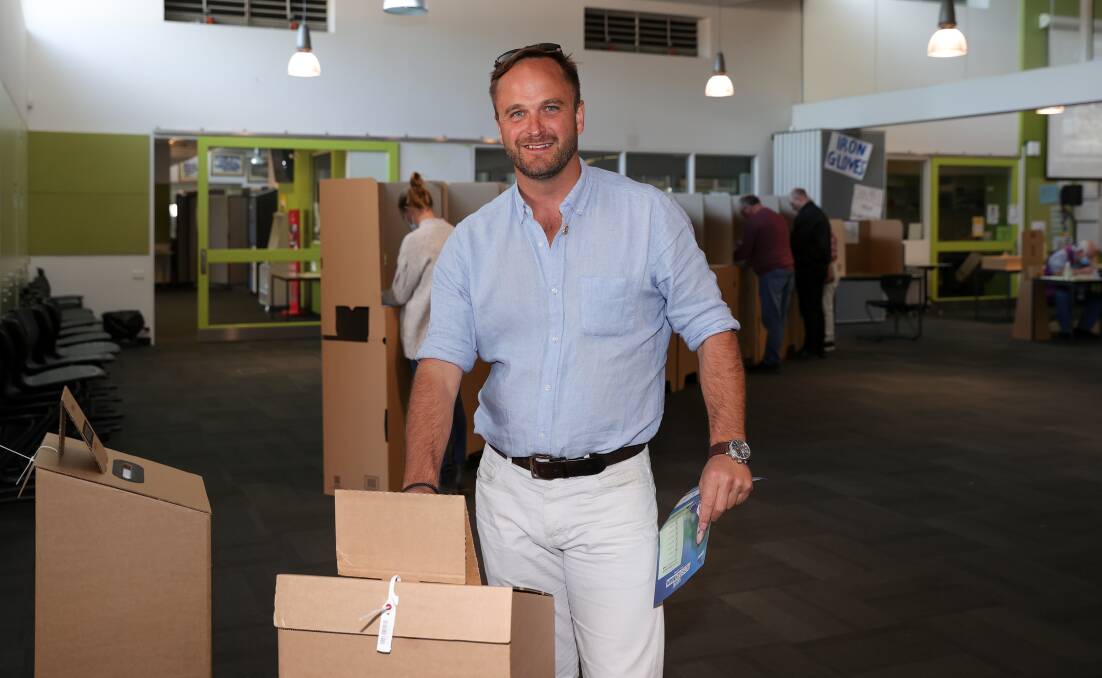Key moment: Liberal candidate Ross Lyman deposits his ballot at Wangaratta High School on Saturday. Picture: JAMES WILTSHIRE