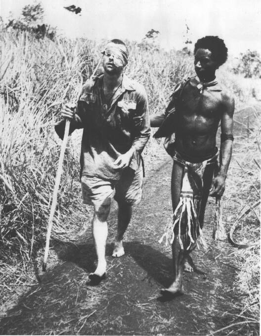 Flashback: Brisbane's George Whittington and Fuzzy Wuzzy Angel Raphael Oimbari on the Kokoda Track on Christmas Day 1942. Picture: AUSTRALIAN WAR MEMORIAL