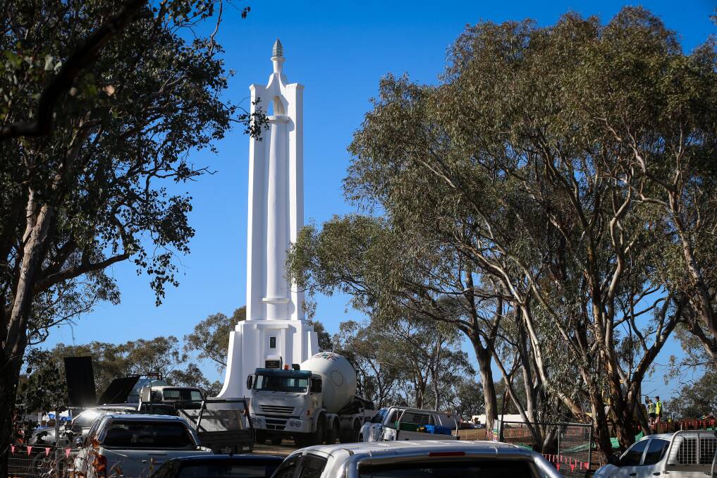 Workers on the job: Contractors on Tuesday were undertaking tasks related to putting down a new bitumen entrance to the Albury war monument. The site upgrade is due to be completed by Anzac Day. Picture: JAMES WILTSHIRE