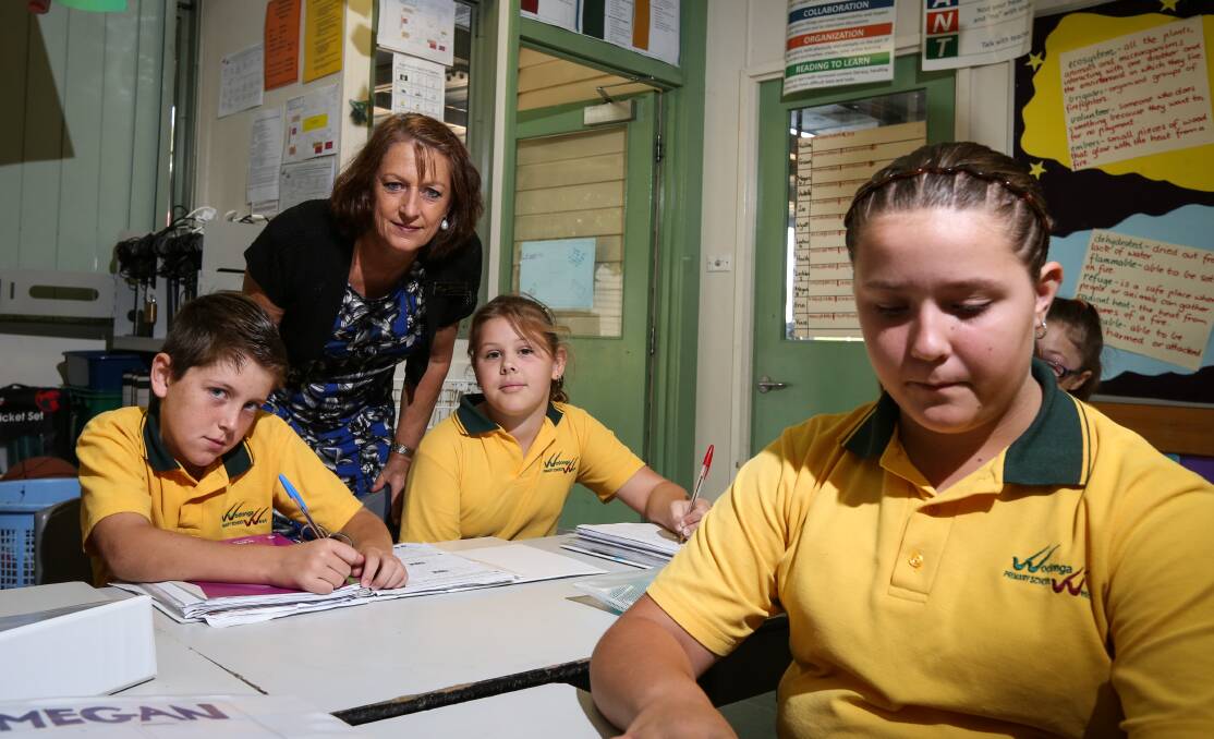 On the rise: Wodonga West Primary School principal Jocelyn Owen with year 6 Heath Hays, 11, year 5 Sheridan Viney, 10, and year 6 Megan Booth, 11. Picture: JAMES WILTSHIRE