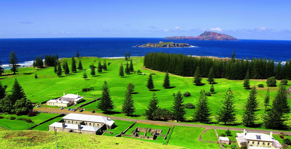 Idyllic sight: The lush green spaces and historic convict era buildings of Norfolk Island are a long way from the dusty Riverina. Picture: NORFOLK ISLAND TOURISM