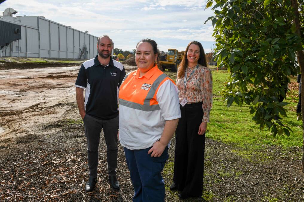 Project manager Aaron Pitson, senior quality technologist Desairee Bruhn and product manager Adena Jurd stand in front of the new factory's site. Picture by Tara Trewhella